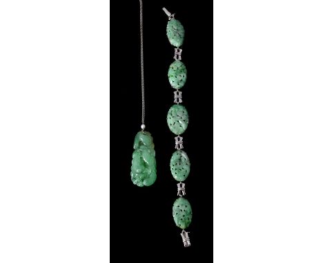 An Art Deco carved jadeite jade and pearl pendant, circa 1930, the carved jadeite jade drop below a pearl, on a belcher link 