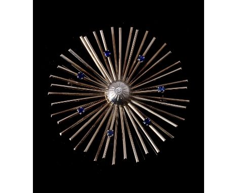 A sapphire and diamond sunburst brooch, the central old cut diamond set in a dome estimated to weigh 0.13 carats, to radiatin