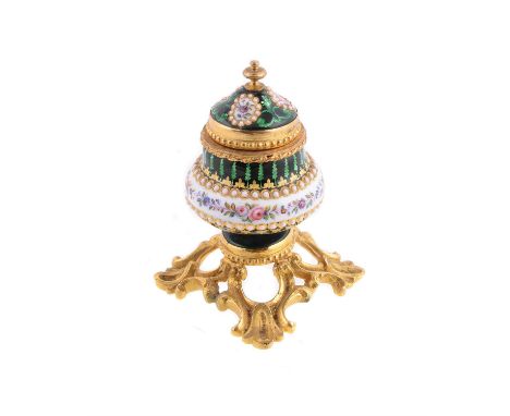 A jewelled enamel and gilt metal inkwell, late 19th century, probably French, painted with flowers on a white ground, within 