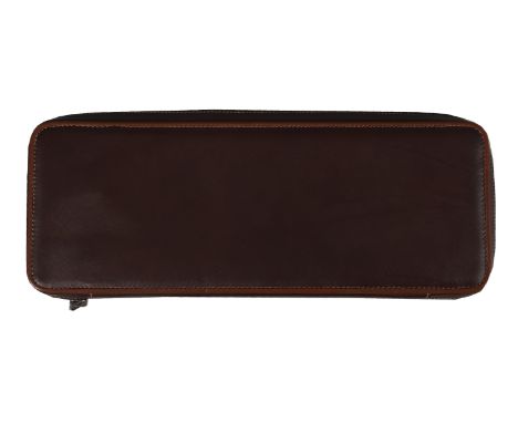 Lanvin, a brown leather tie case, the zip opening to a paisley interior, with two hangers, four straps and a button pocket, 4