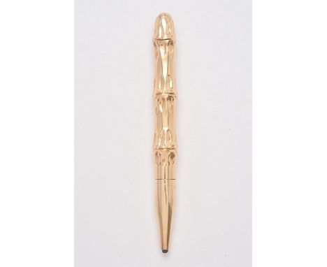 A gold coloured bamboo propelling pencil by T. & Son, stamped 14K, 25g grossCondition Report: Light scratches and wear commen