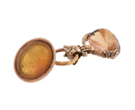 A Regency citrine swivel fob seal, circa 1835, the citrine engraved remember me, with a chased foliate setting, 3.2cm long; a