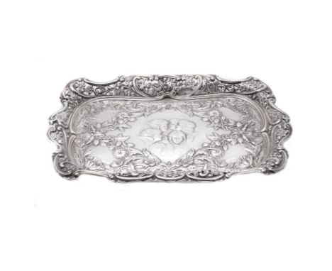 An Art Nouveau silver rectangular dressing table tray by Barker Brothers, Birmingham 1903, the shaped and pierced border with