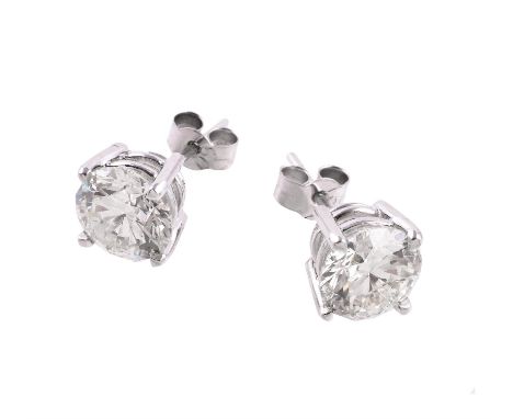 A pair of diamond single stone ear studs, the brilliant cut diamonds, estimated to weigh 2 carats each, in four claw mounts w