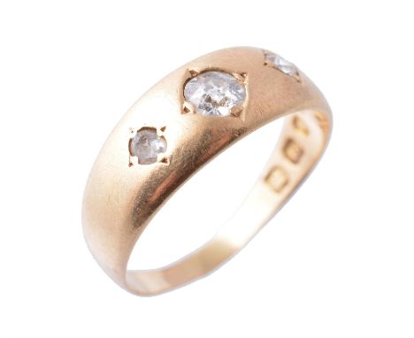 An 18 carat gold diamond ring, set with three old cut diamonds, approximately 0.20 carats total, stamped 18 with full London 