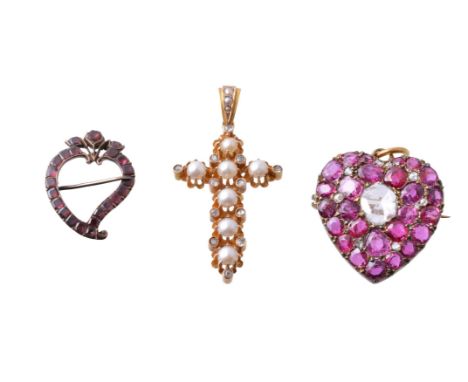 A late 19th century ruby and diamond heart shaped brooch/pendant, circa 1900, the central rose cut diamond within a surround 