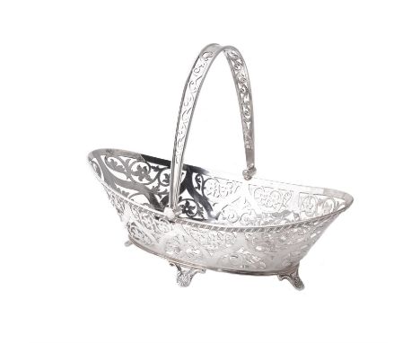 An Edwardian silver oval swing handled basket by William Hutton & Sons Ltd., London 1905, with a foliate pierced swing handle