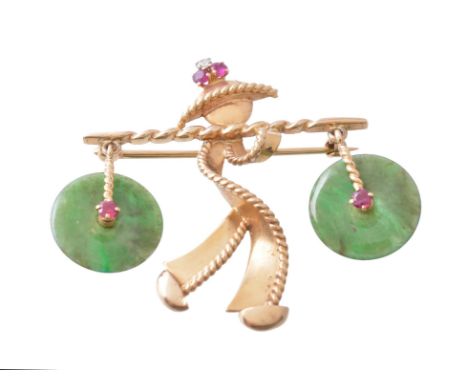 A 1960s jadeite and gem set brooch, the man with a ruby and diamond set hat carrying two jadeite jade buckets each set with a