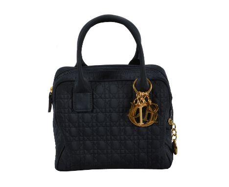 Christian Dior, Petit Boston, a marine blue Cannage microfibre quilted handbag, with twin loop handles, a zipped side pocket 