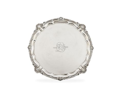 A large Edwardian silver shaped circular salver by Harrison Brothers & Howson, London 1905, with a bold raised gadrooned rim 