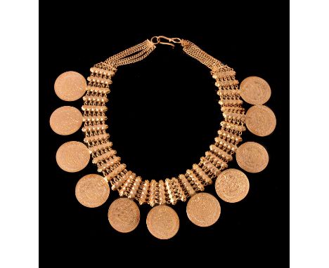 A coin necklace, set along the fringe with 11 jeweller's copy Middle Eastern coins, suspended from a fancy link collar, indis