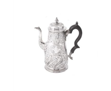 A George II silver coffee pot by Edward Vincent, London 1739, with a bell shaped finial to the foliate chased dome cover, a c