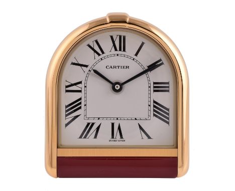 Cartier, Romane, Ref. 6602,Gilt metal and red lacquer alarm clock, no. 1U07751Movement: Quartz alarm movementCase: Gilt metal