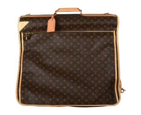 Louis Vuitton, a monogrammed canvas suit carrier, with a leather loop handle and gilt metal hardware, three zipped pockets, a