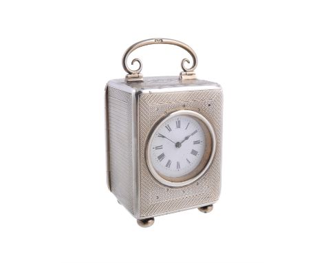 An Edwardian silver carriage clock by John Pound & Co., London 1907, French movement, white dial, Roman numerals, blued steel