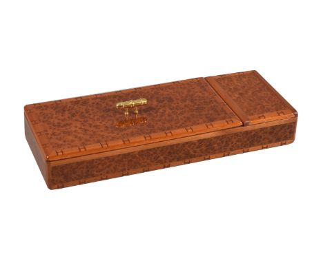Hermes, a brown lacquered desk tidy, with a monogram border, the pull off cover with a gilt metal handle, opening to a three 