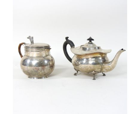 An early 20th century silver lidded jug, with a woven handle, Birmingham 1912, 372g, 14cm, together with another silver teapo