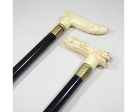 A modern novelty walking stick, with a carved bone handle, together with another, longest 94cm (2)