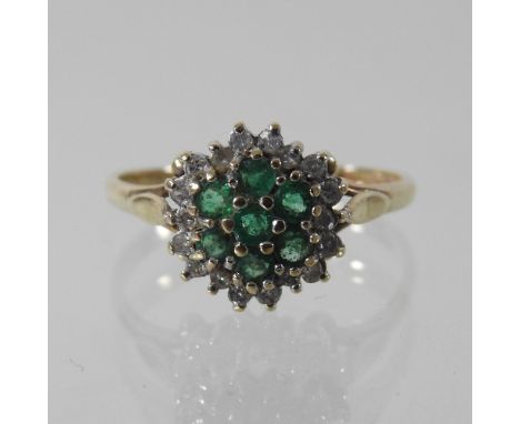 A 9 carat gold emerald and diamond cluster ring, boxed, size L, together with a coloured resin designer ring