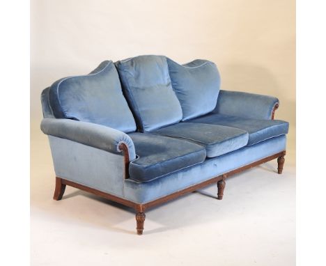 A 1920's blue upholstered three piece suite, comprising a sofa, 189cm, and a pair of armchairs