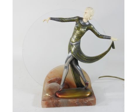 An Art Deco style figural table lamp, on a marble base, with an etched glass shade, 35cm high