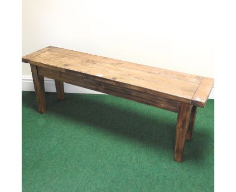 A stained pine bench, 133cm