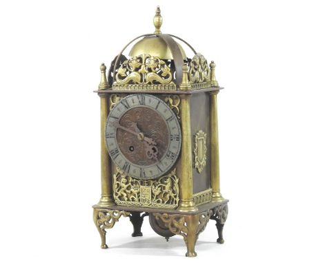 An early 20th century Danish brass cased lantern clock, with scrolled decoration, 36cm high