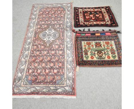 An Iranian woollen saddle bag, 68 x 66cm, together with another and a runner (3)