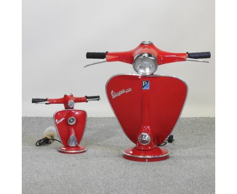 A large modern red painted table lamp, in the form of a vespa, 61cm high, together with another smaller