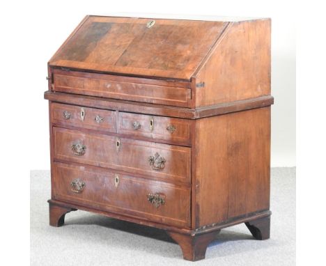 An 18th century and later walnut bureau, on bracket feet, 92cm