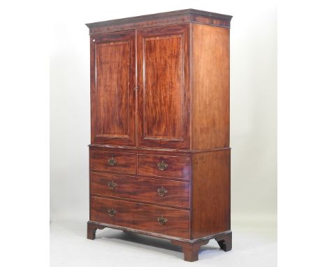 A Regency mahogany and inlaid linen press, fitted with slides, on bracket feet, 132cm