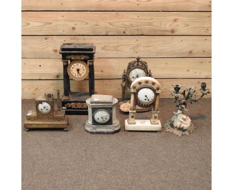 A 19th century portico clock, 46cm, together with four others various and a candelabra in the form of a cherub 