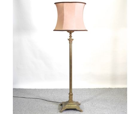 A brass Corinthian column standard lamp and shade, 177cm high overall