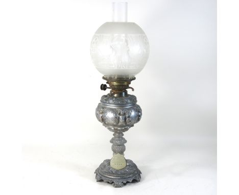 A 19th century spelter oil lamp and shade, bearing a plaque inscribed 'Presented to Mrs Myhill', 54cm high