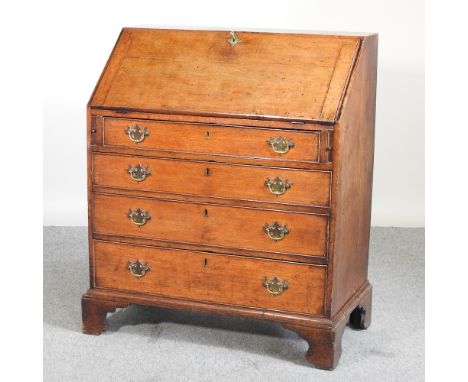 A George III oak bureau, on bracket feet, 88cm