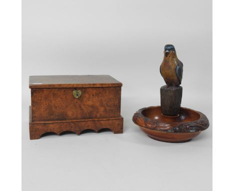A burr walnut casket, together with a novelty nut cracker in the form of a parrot, 29cm high