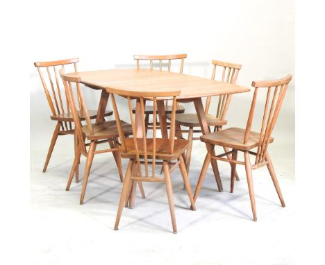 A 1970's Ercol light elm drop leaf dining table, 137 x 74cm, together with a set of six spindle back Ercol dining chairs