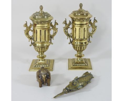 A pair of 20th century decorative brass urns, 24cm high, together with a brass inkwell, a flask in the form of a fish