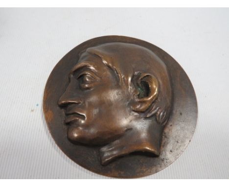 An unusual bronze sculptural art medal, depicting a high relief portrait of a man D - 9 cm