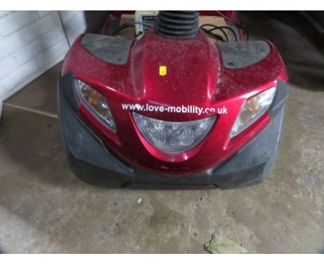 An Invacare mobility scooter with key 