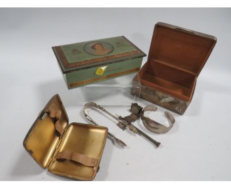 A quantity of hallmarked silver to include a cigarette case approx. weight 88g, cigarette box apostle style sugar tongs, coin