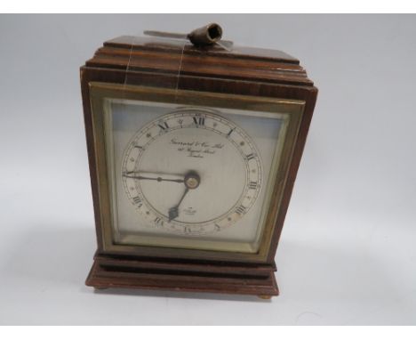 A small Elliot oak cased Garrard mantle clock with key 