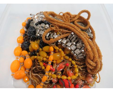 A box of vintage jewellery to include a collerette and flapper type necklaces 