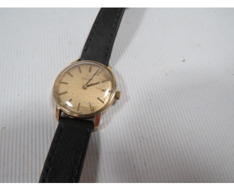 A ladies vintage Omega wristwatch in original box possibly 9 carat on a replacement leather strap with engraved presentation 