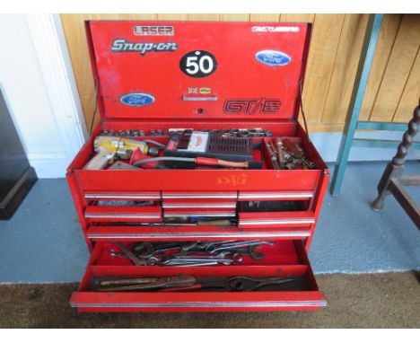 A steel Snap On Tool box cabinet with contents, comprising various tools and testers