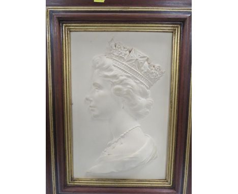 A framed Royal Worcester ceramic portrait of The Queen by Arnold Machin dated 1976 