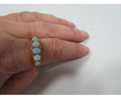 An 18ct five stone opal ring approx. weight 4.9 