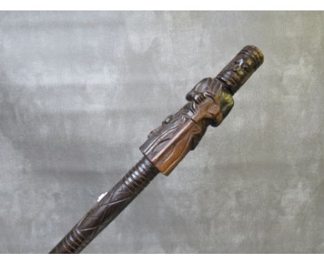 A VINTAGE CARVED WOODEN WALKING STICK, with religious figure as handle, L 87 cm