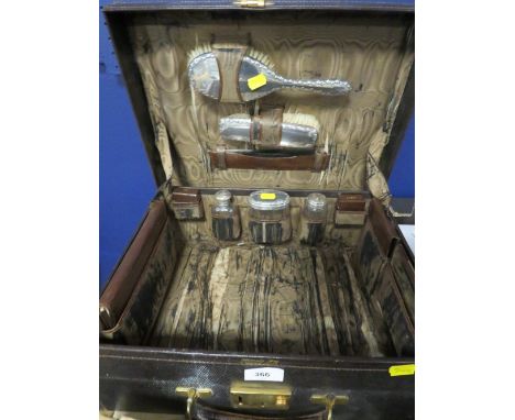 Harrods Ltd leather travel case, fitted with various silver top jars and various leather covered items, to include a travel i