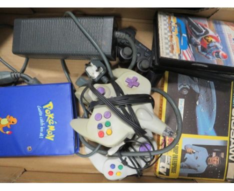 Two boxes of oddments to include a file containing over 100 Pokémon cards, two computer game controllers, land of illusion an